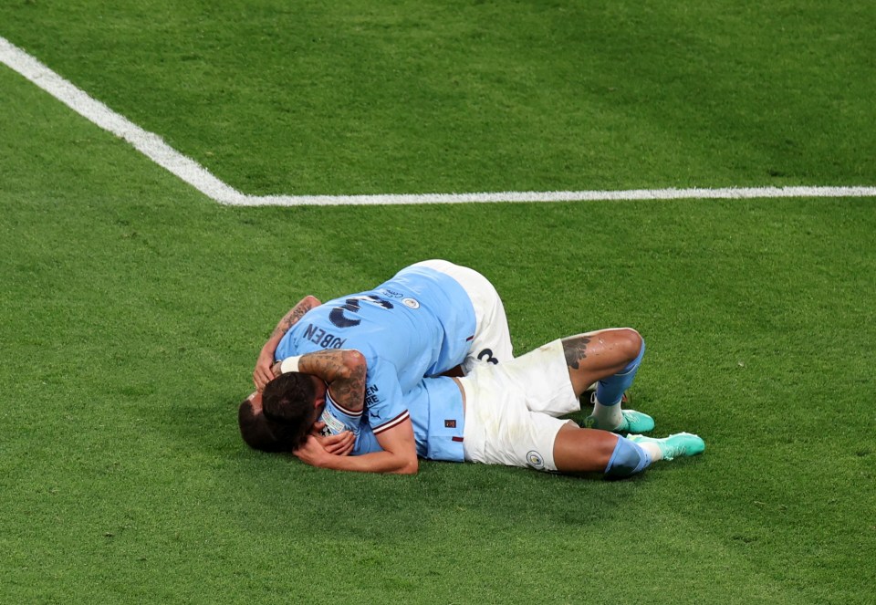 Man City celebrate upon the final whistle