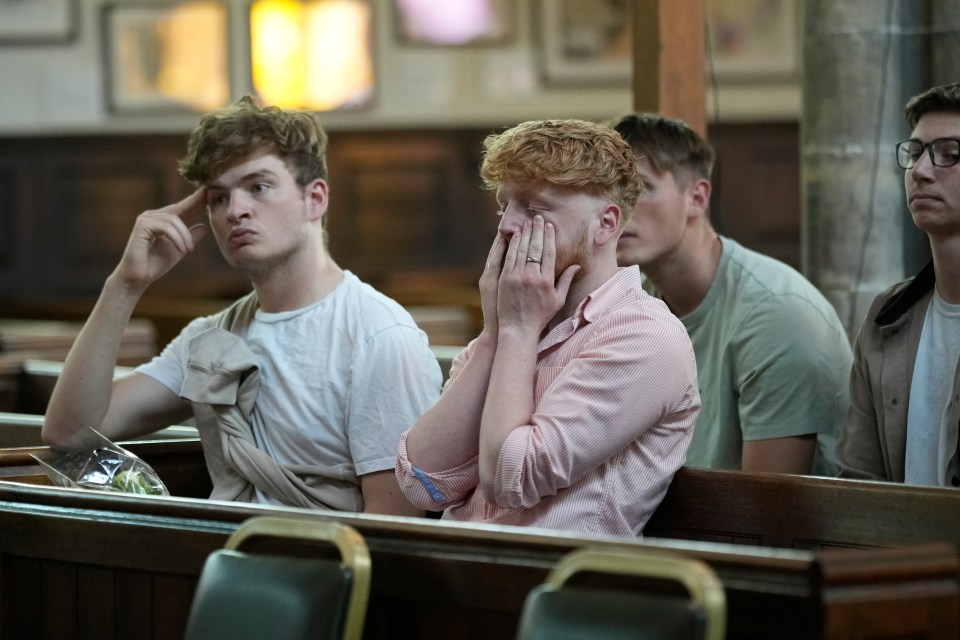 Mourners gather for a vigil in Nottingham on Tuesday following the murder of Barnaby and Grace