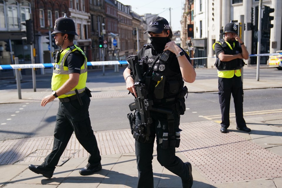 Armed police at the scene in Nottingham city centre where a 31-year-old man has been arrested on suspicion of murder following the van rampage