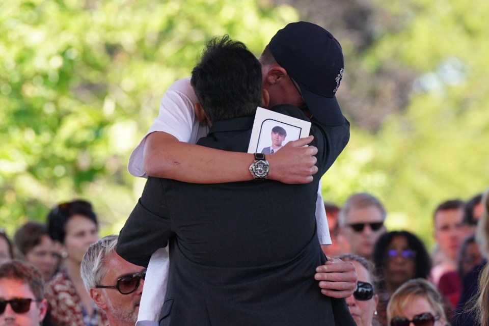 Grace Kumar’s dad Dr Sanjoy Kumar and Barnaby’s brother, Charlie, embrace