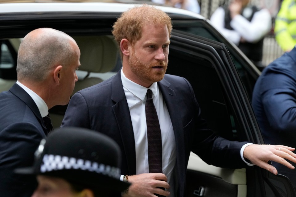 Prince Harry exited a black Range Rover