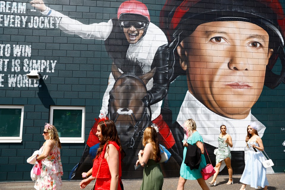 Punters pile past a Frankie mural at Epsom as his horse gets backed for his final ever Epsom Derby