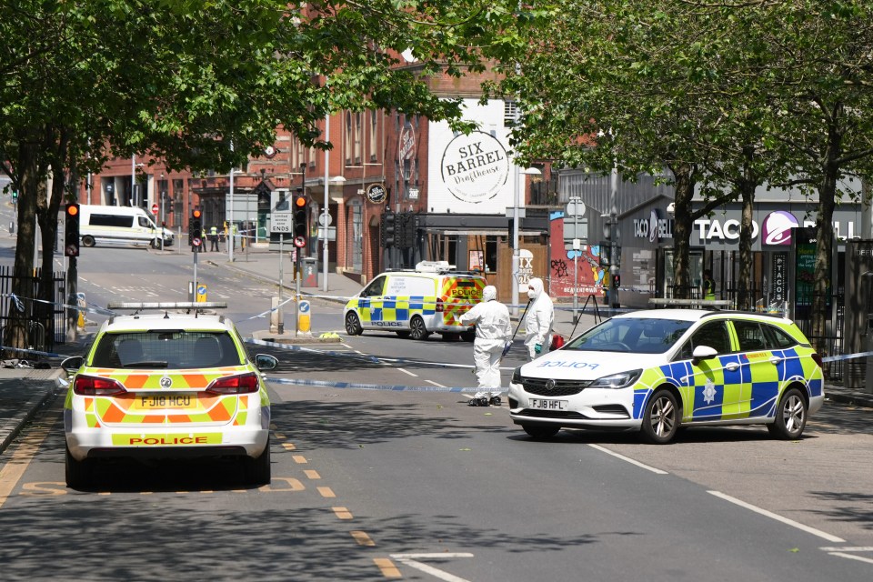 Police forensics officers are seen at the scene in Nottingham