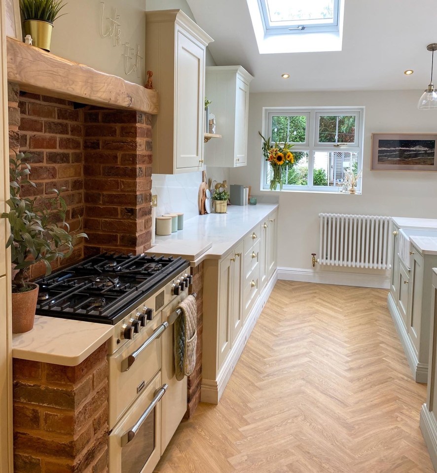 The kitchen has matching brick to the period home