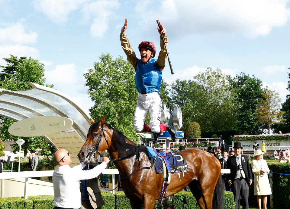 Dettori does his famous flying dismount after finally getting a winner