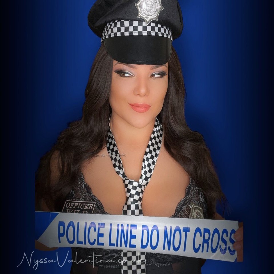 She goes by the aliases Officer Wild and Nyssa Valentina