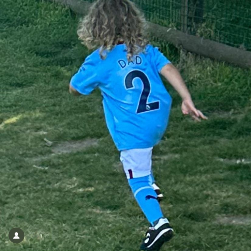 Lauryn posted a pic of her son playing in the garden wearing kit with his dad’s number