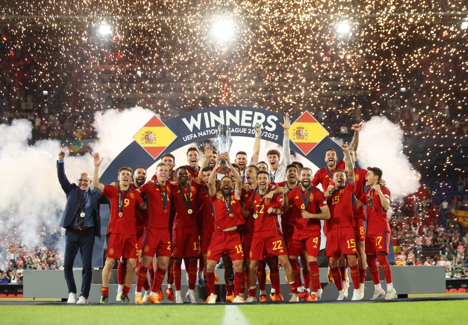 ROTTERDAM, NETHERLANDS - JUNE 18: Jordi Alba of Spain lifts the UEFA Nations League trophy after the team's victory in the UEFA Nations League 2022/23 final match between Croatia and Spain at De Kuip on June 18, 2023 in Rotterdam, Netherlands. (Photo by Dean Mouhtaropoulos - UEFA/UEFA via Getty Images)