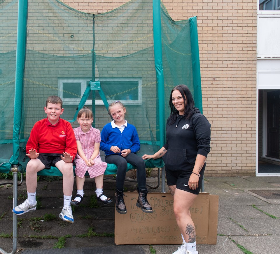 Children who use the communal trampoline on Kineton Croft pictured with Melissa Jamie (right), one of the parents who funded it