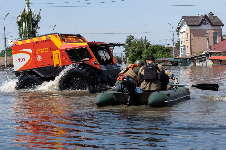 Ukrainian security forces and rescuers work to save people around Kherson