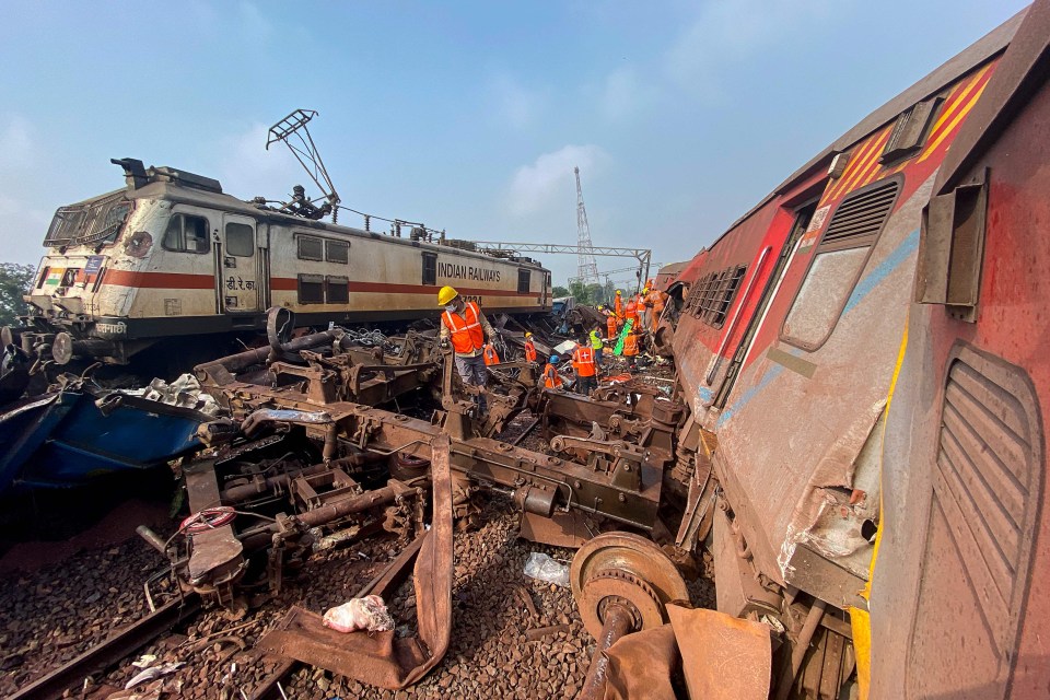 Rescue workers sifts through wreckage at the tragic scene