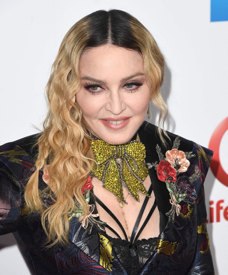 (FILES) Madonna attends the Billboard Women in Music 2016 event on December 9, 2016 in New York City. Madonna is recovering after falling ill with a "serious bacterial infection" that landed her in an intensive care unit for several days, her manager Guy Oseary said in a statement posted to social media on June 28. "Her health is improving, however she is still under medical care," he said. "A full recovery is expected." Oseary said the pop icon's "Celebrations" tour, due to start July 15 in Vancouver, was postponed until further notice. (Photo by ANGELA WEISS / AFP) (Photo by ANGELA WEISS/AFP via Getty Images)