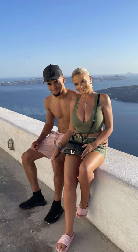 The couple pose for a picture together on holiday