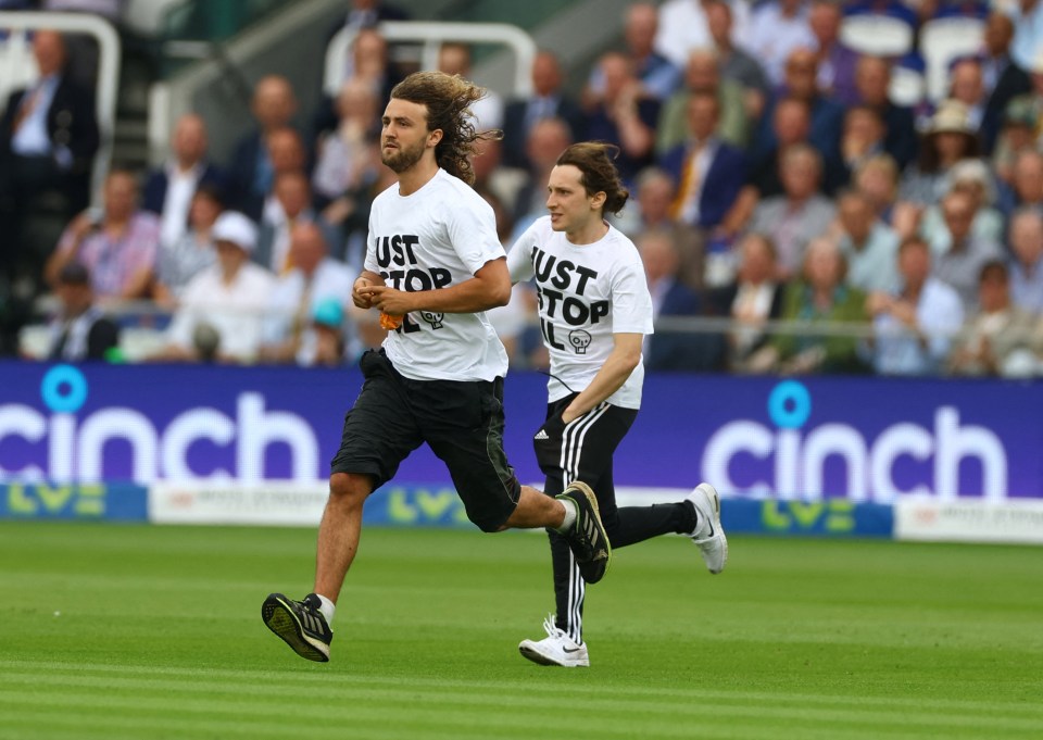 Two other activists tried to hurl orange powder over the pitch