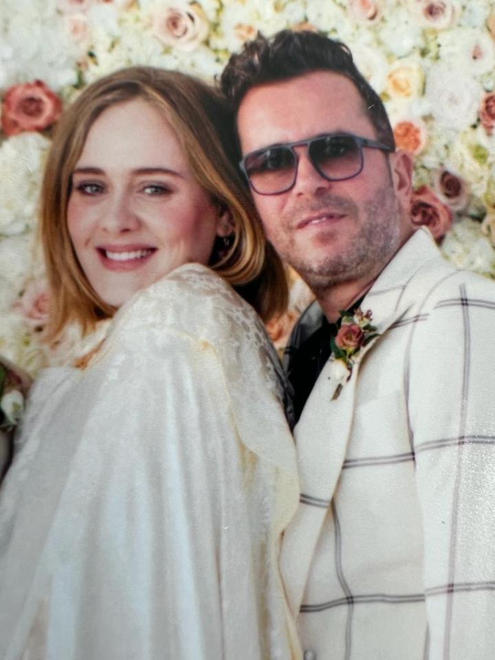 Paul has commended Adele for her sage advice during hard times, pictured Paul with Adele at his wedding to Alan