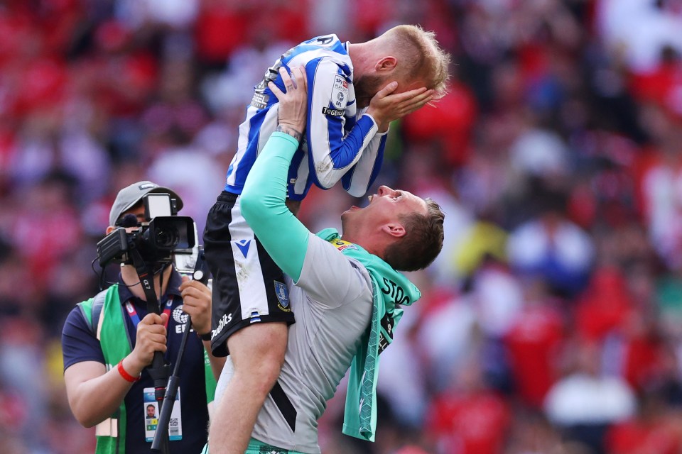 Goalie David Stockdale and Barry Bannan celebrating Sheff Wed’s play-off win over Barnsley