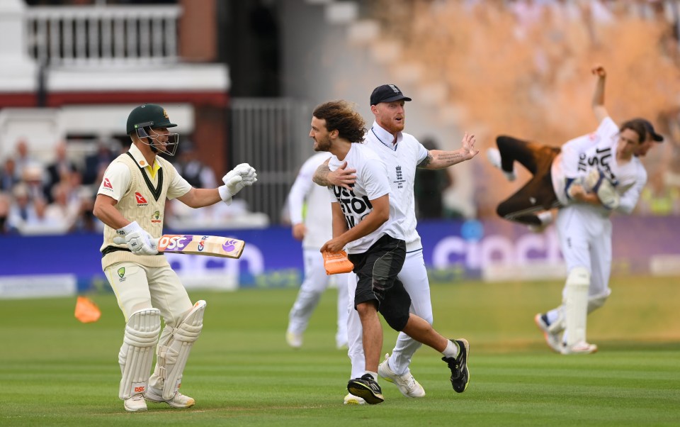 England captain Ben Stokes and Australian opener David Warner confront another protester