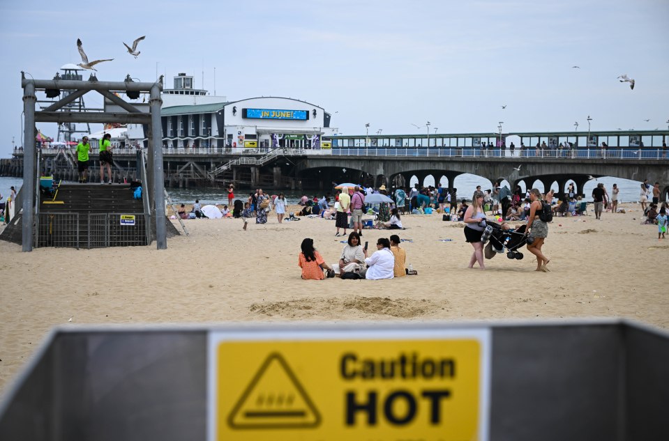 A high heat alert has been issued across England. Pictured: A caution hot sign is seen on Bournemouth Beach