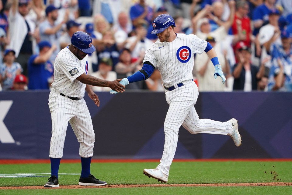 Ian Happ completes a home run for the Chicago Cubs during Saturday's 9-1 win