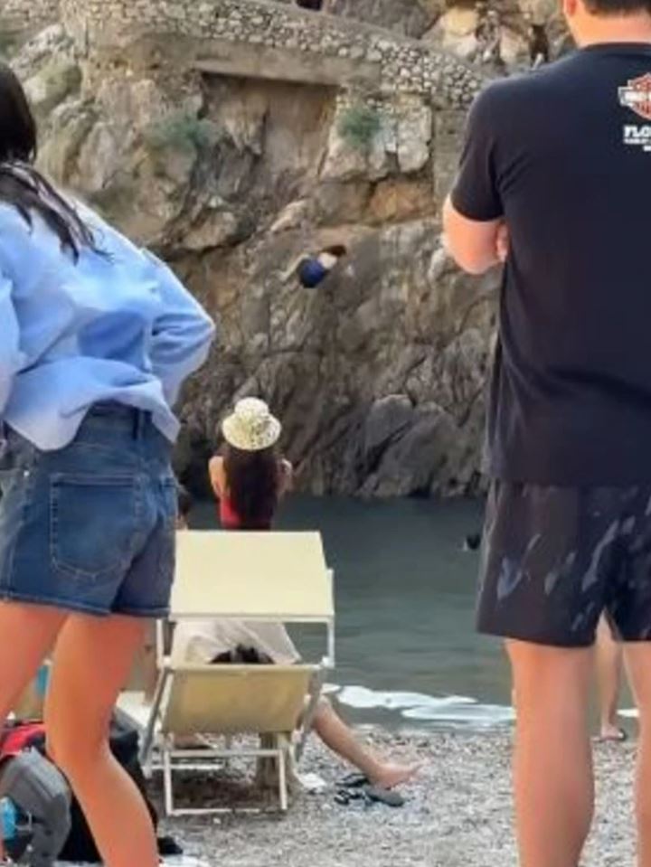 The woman screamed as she fell onto the rocks below