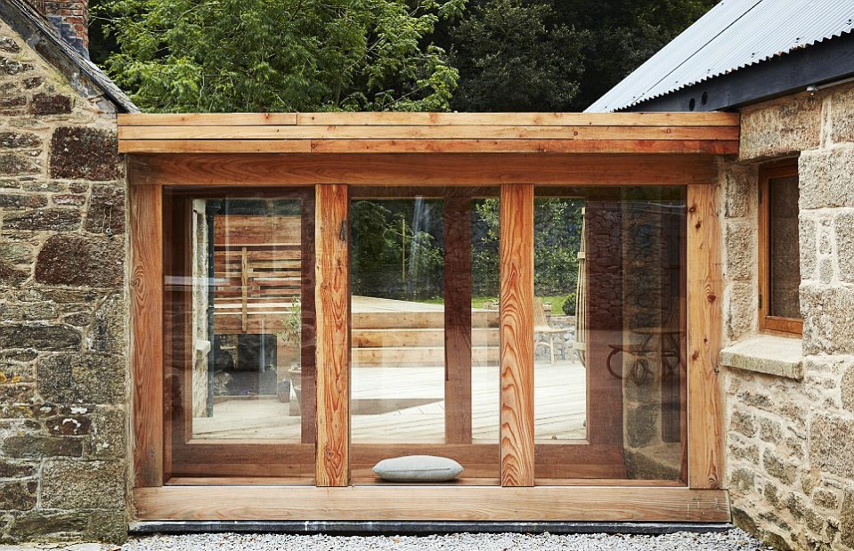 The house has a glass walkway connecting to the gamekeeper's cottage