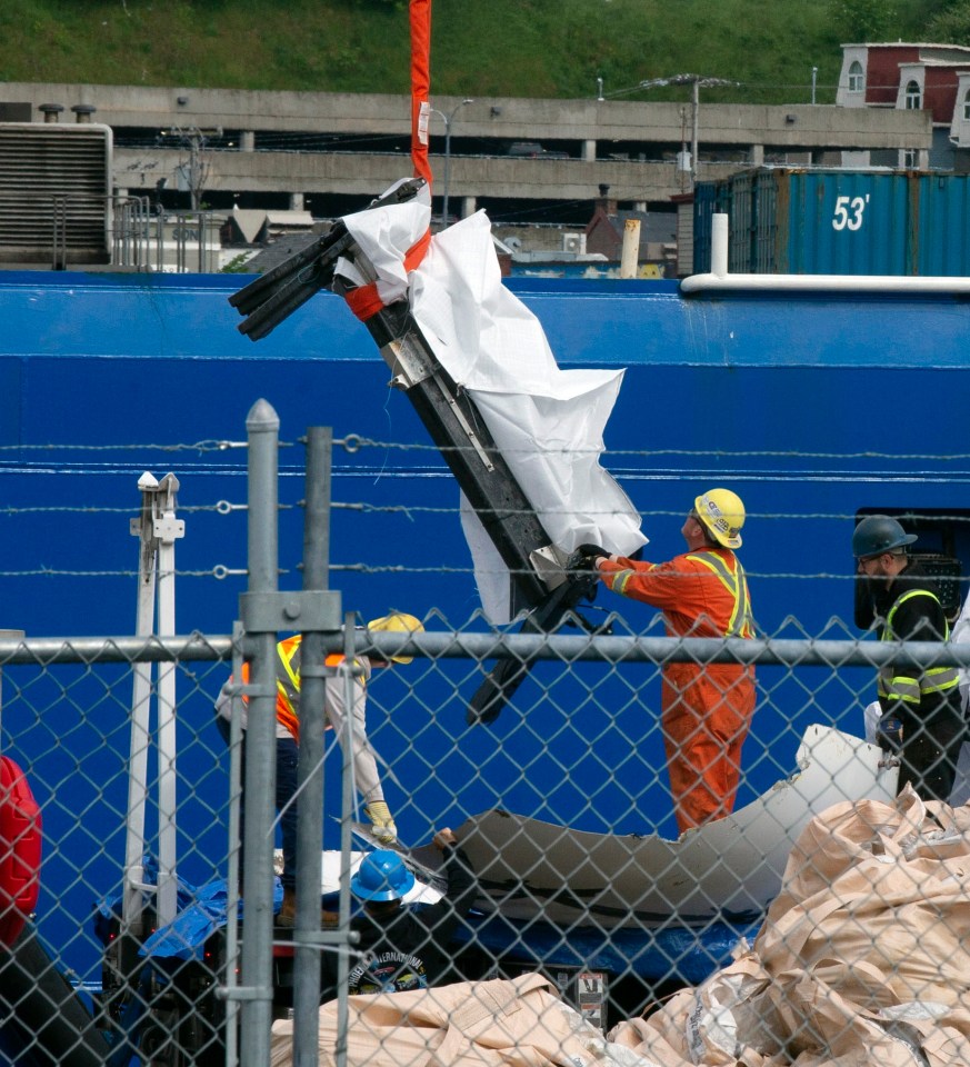 The debris was quickly covered up before being lifted by cranes on to lorries