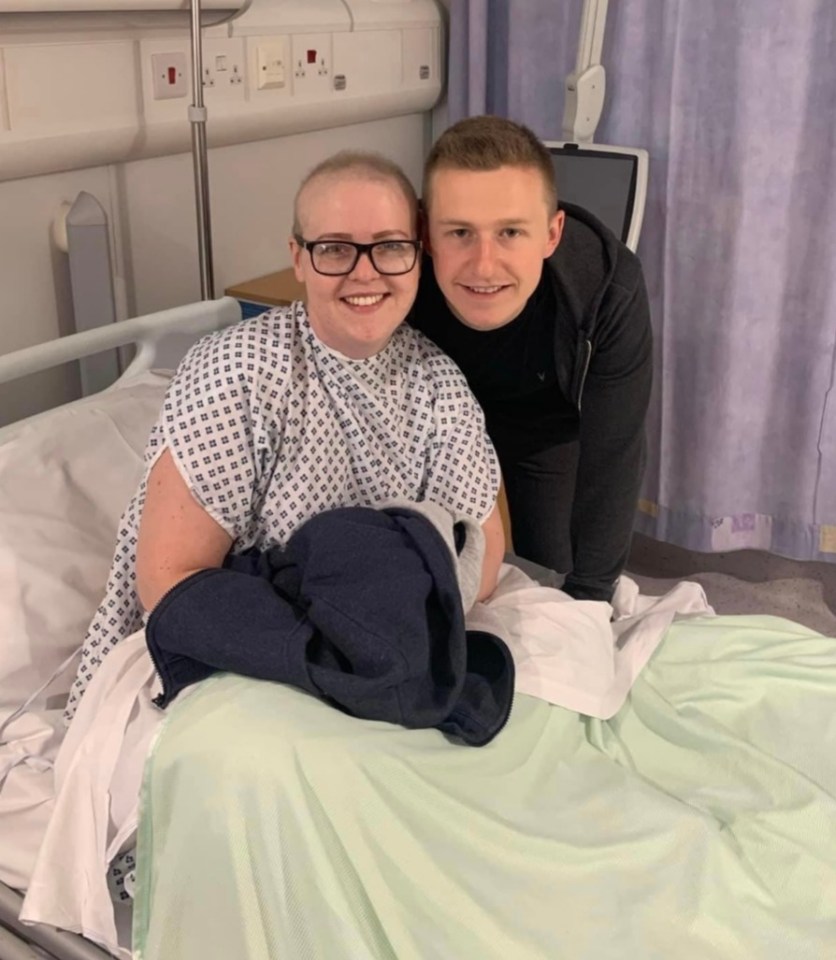 The 29-year-old in hospital with her partner Cameron