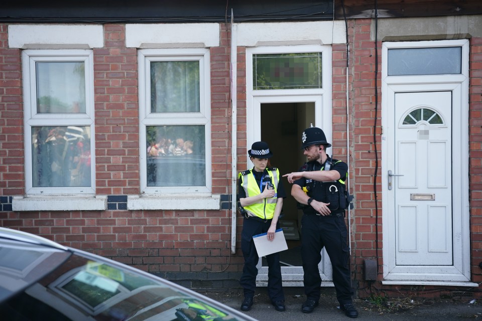 Police were later seen standing guard outside the home that was raised by terror cops