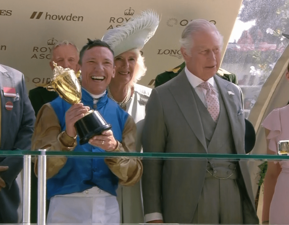 Dettori holds the Gold Cup after accepting the trophy from King Charles and Queen Camilla