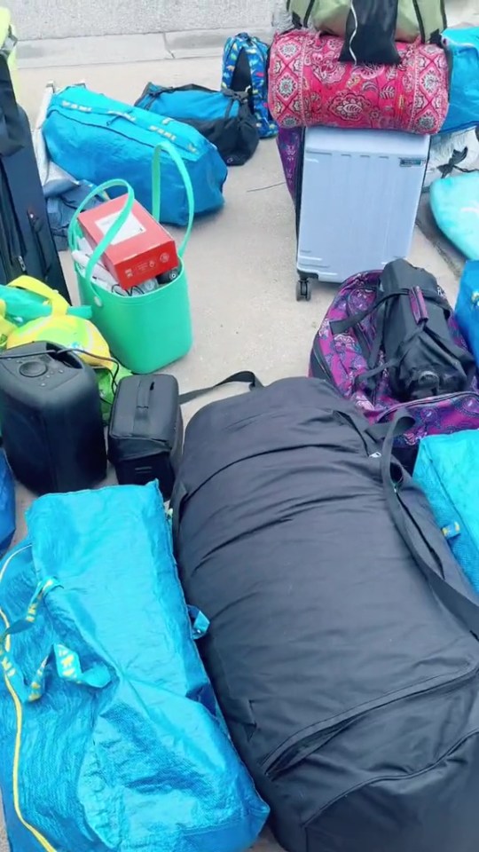 The family take a whole driveway of luggage