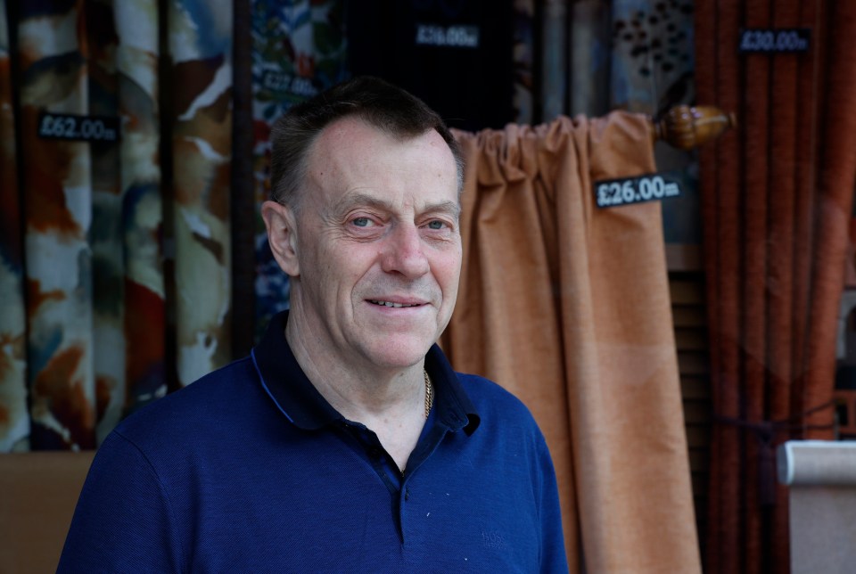 Ian Barrington, 64, owner of Designer Drapes in his shop