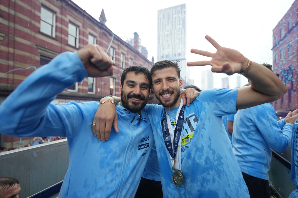 Gundogan and Dias enjoying the bus in the rain