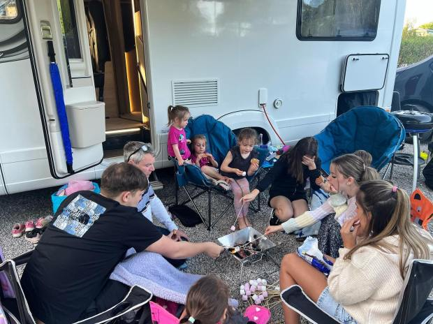 The bumper family enjoy making smores and having movie nights on the motorhome breaks