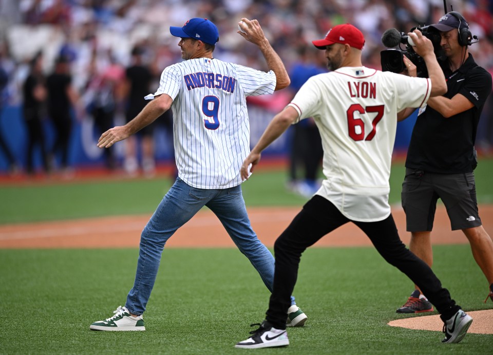 England fast bowler Jimmy Anderson and Aussie spinner Nathan Lyon threw ceremonial first pitches before Saturday's game