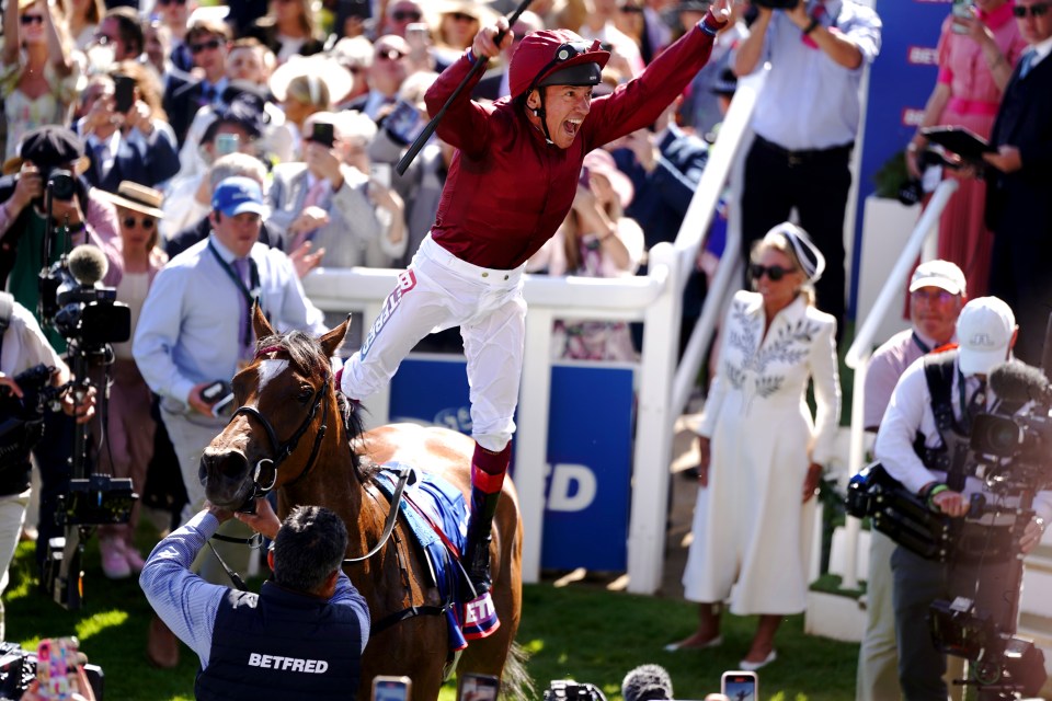 Frankie Dettori leaps off Soul Sister following their Oaks success