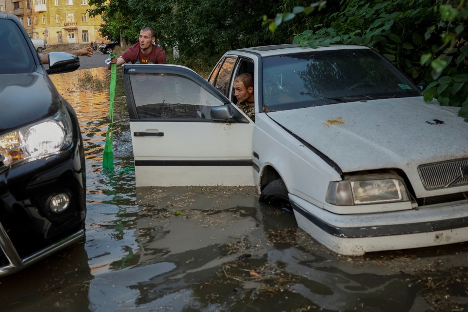 Locals were seen trying to retrieve their cars