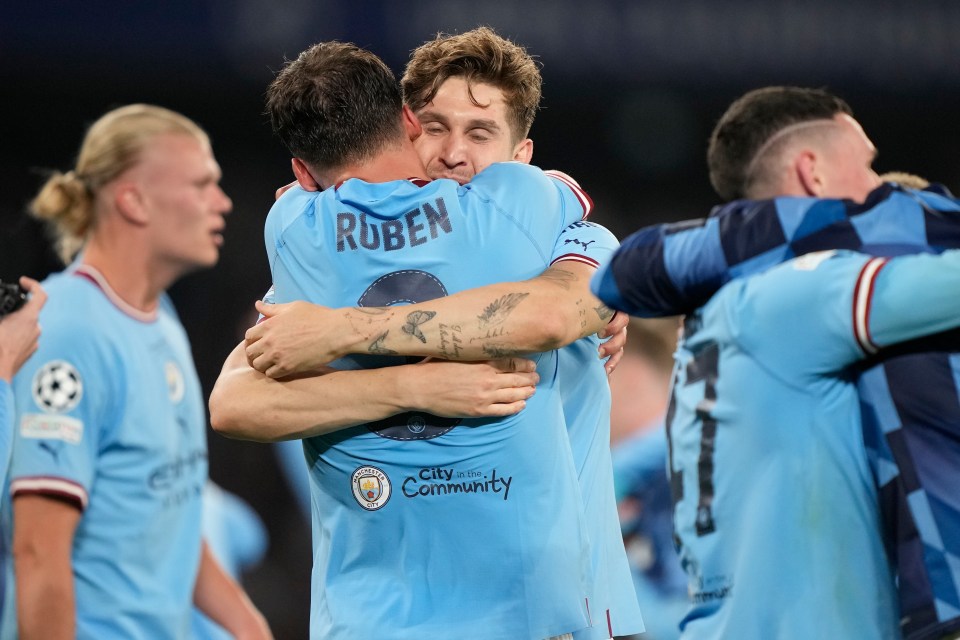 John Stones hugs his defensive partner