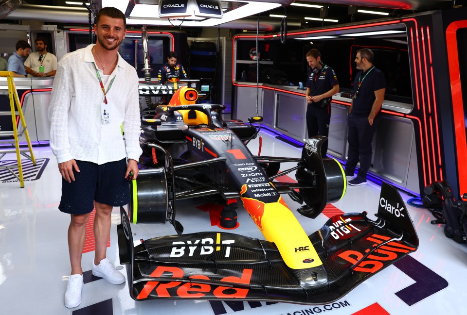 Mount, pictured posing in the Red Bull Racing garage, is at the Spanish GP