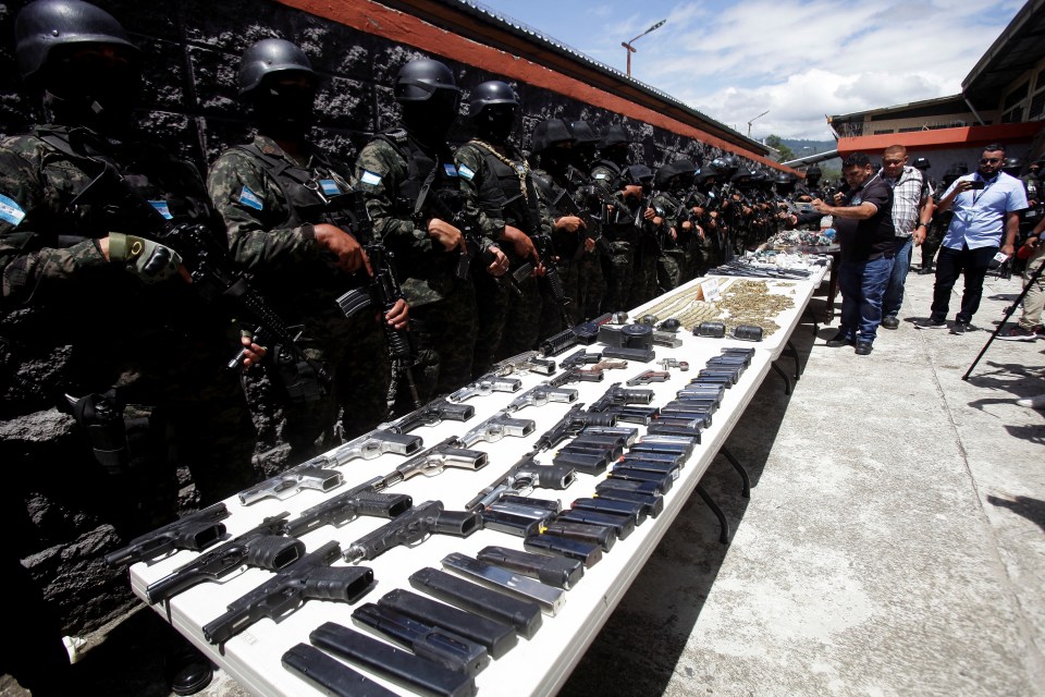 Cops found hundreds of rounds of ammunition, pistols, assault rifles and grenades