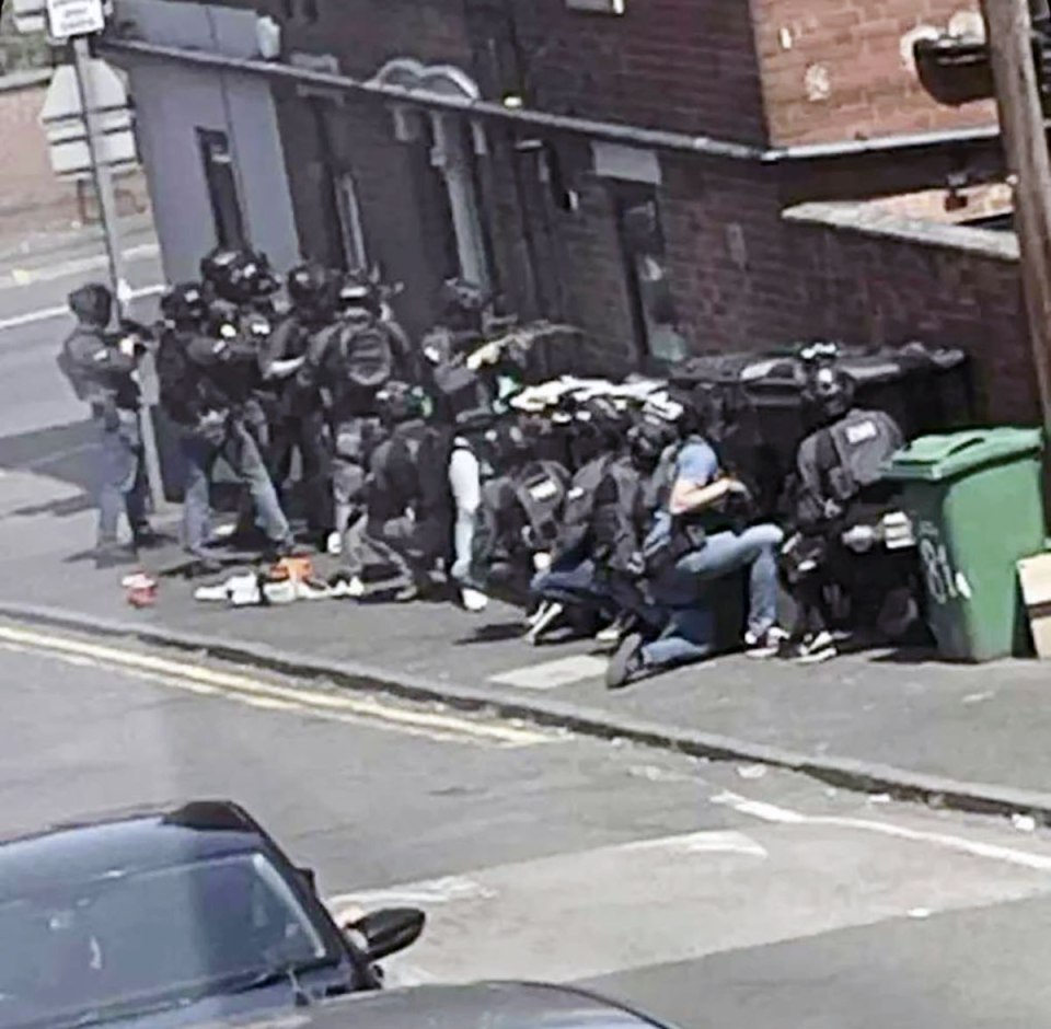 Terror cops prepare to raid an address on Ilkeston Road in Nottingham