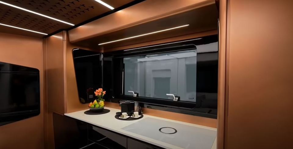 In the kitchen, the heart of the motorhome, tenants could keep their beverages in a Miele wine fridge