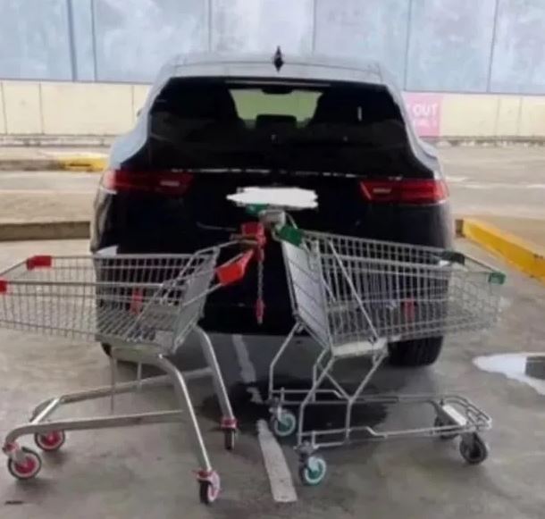 Shoppers hilariously blockaded the car with not one but five, shopping trolleys