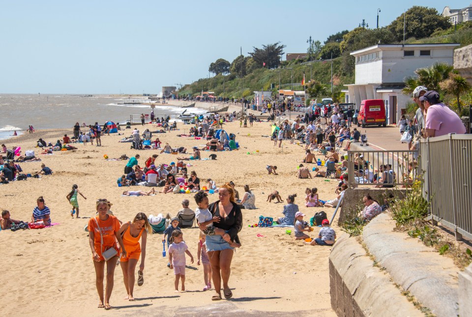 Brits enjoy the sunshine at the beach on Clacton-on-Sea on Sunday