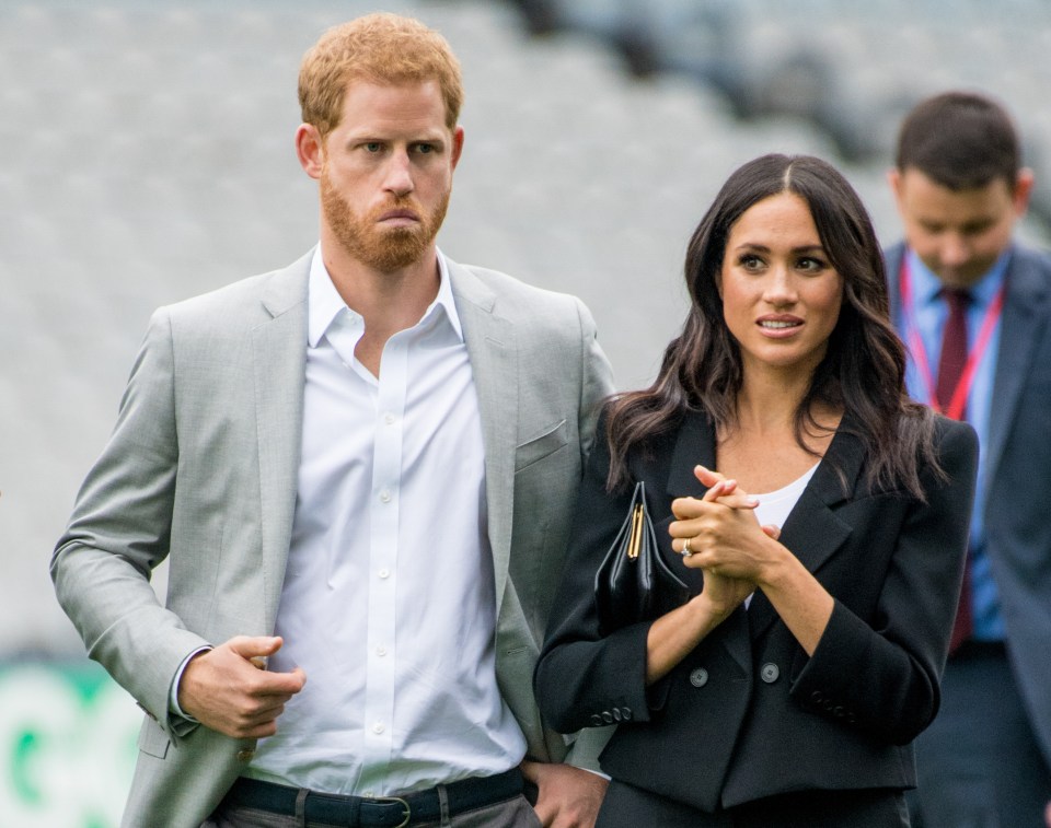 Harry, pictured with Meghan Markle, volunteered details on his love life including a trip to a strip club