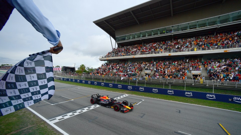 Max Verstappen speeds across the finish line