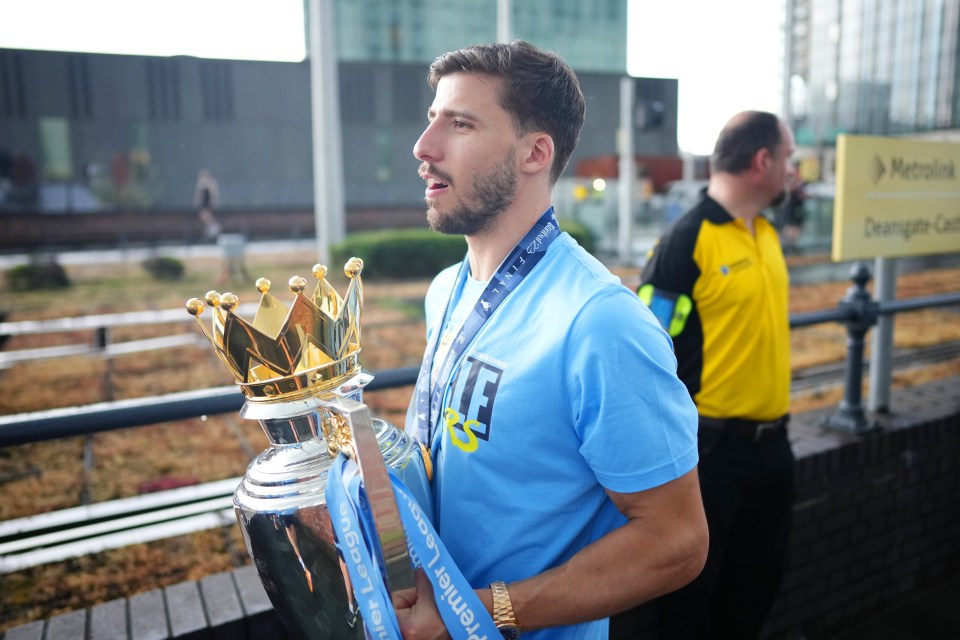 Dias was pictured with the Premier League trophy