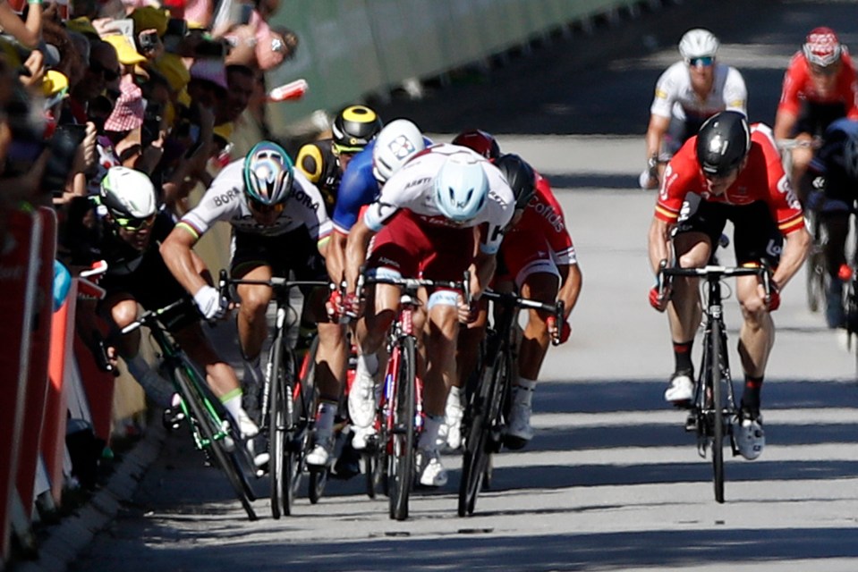 Peter Sagan, centre left, forced Mark Cavendish, far left, into the barrier and was disqualified from the race