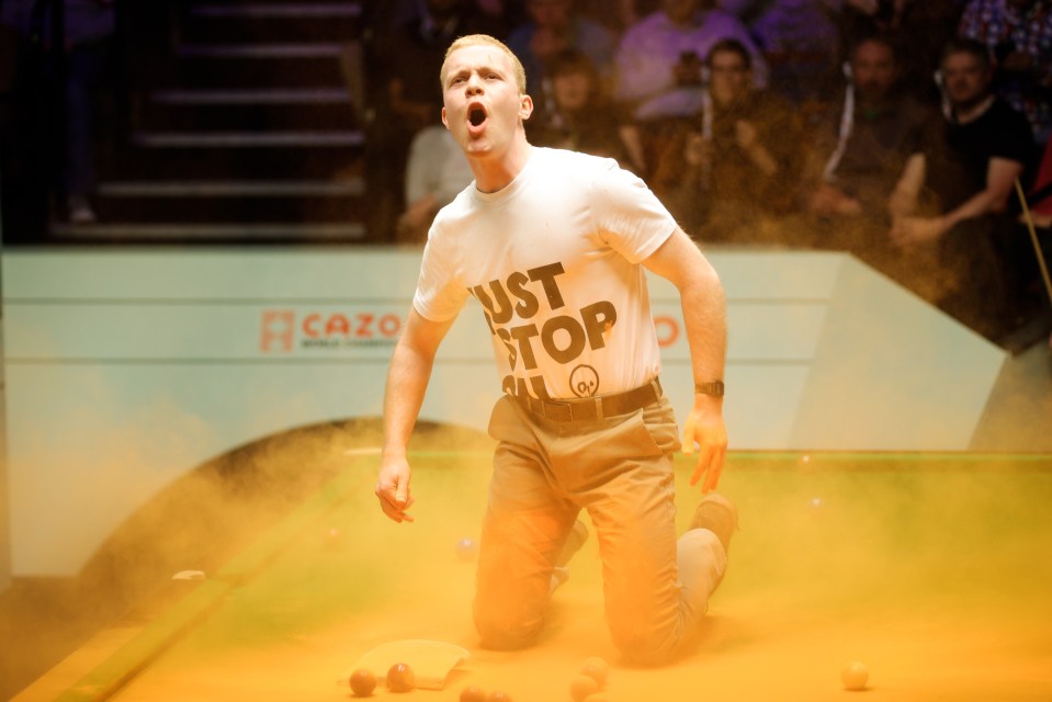 A Just Stop Oil protester threw orange powder over the table at the World Snooker Championship