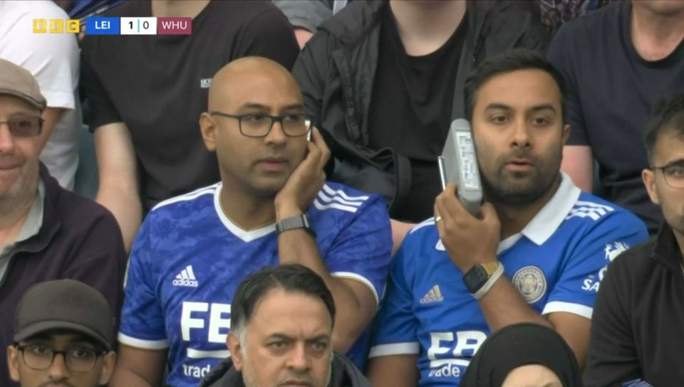 Rival supporters let rip when they spotted a fan of relegated Leicester City listening to a radio with his dad’s phone number on it