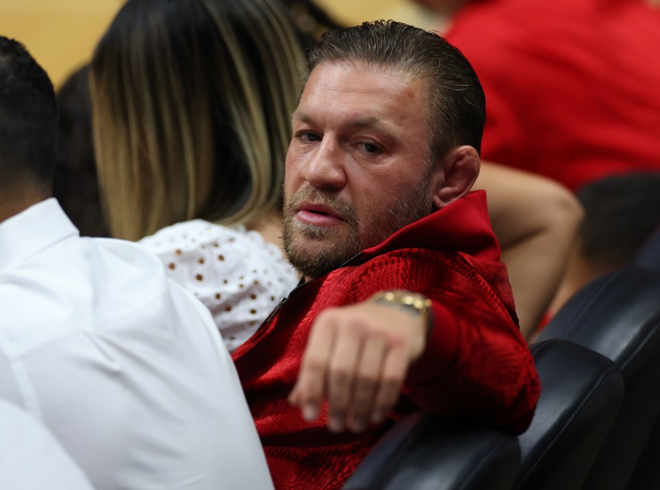 MgGregor was pictured watching the game and joined the on-court entertainment during a break in play